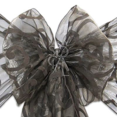 CHAIR SASH SHEER ORGANZA: Close-up of a sheer organza chair sash tied into a bow, highlighting its elegant texture and versatile design for event decor.