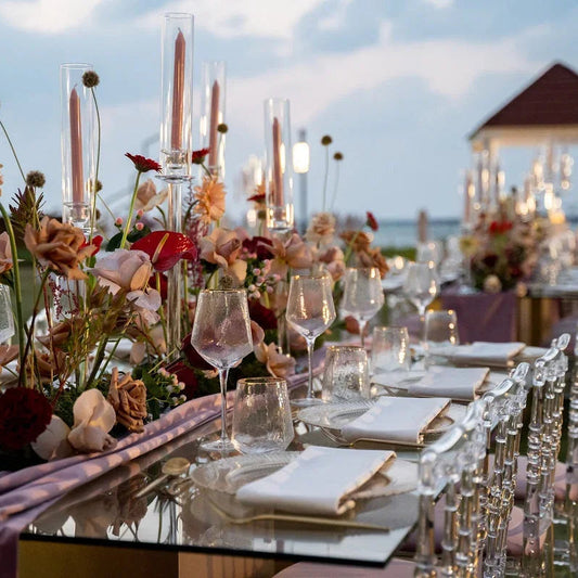 Gold Rimmed Geometric Glasses on an elegantly set dinner table with flowers and candles, ideal for enhancing premium event settings.