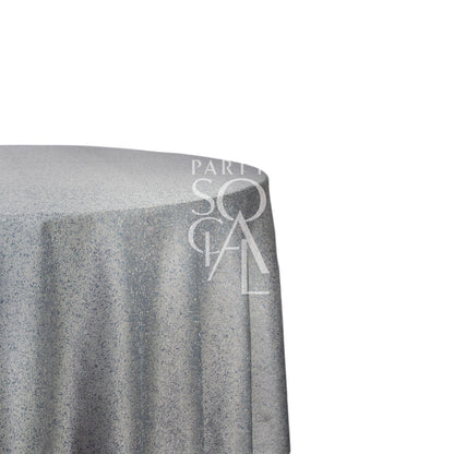 ROUND TABLECLOTH JACQUARD displayed on a table, showcasing its premium fabric texture, ideal for enhancing the elegance of special occasions.