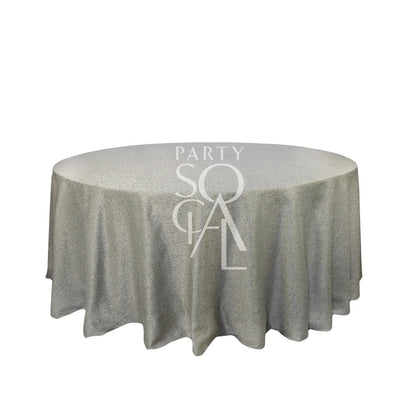 Round table with a Premium Jacquard Tablecloth, ideal for special occasions. Suitable for events by Party Social, enhancing any party setting.