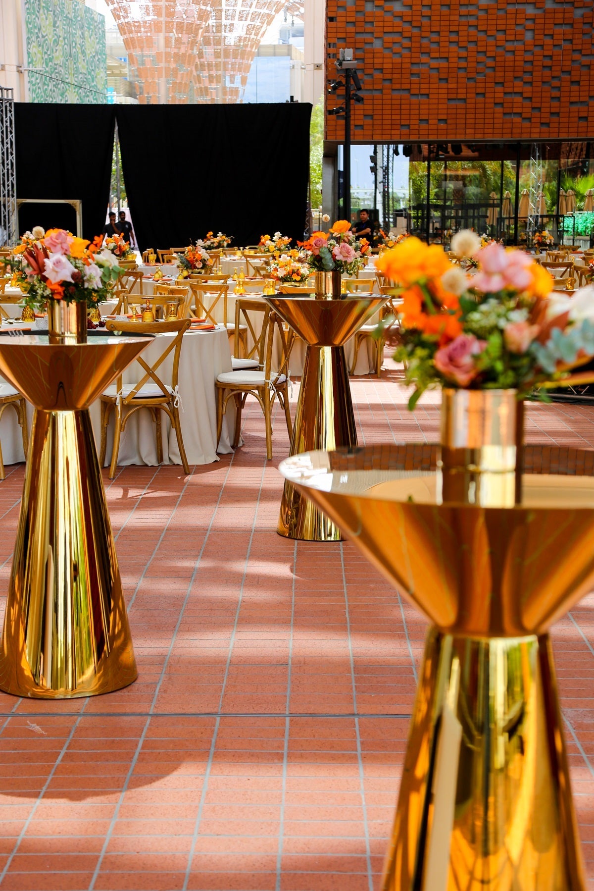 Gold Mirror Cocktail Tables showcased with chairs, featuring a sleek design perfect for versatile event settings, ideal for parties by Party Social.