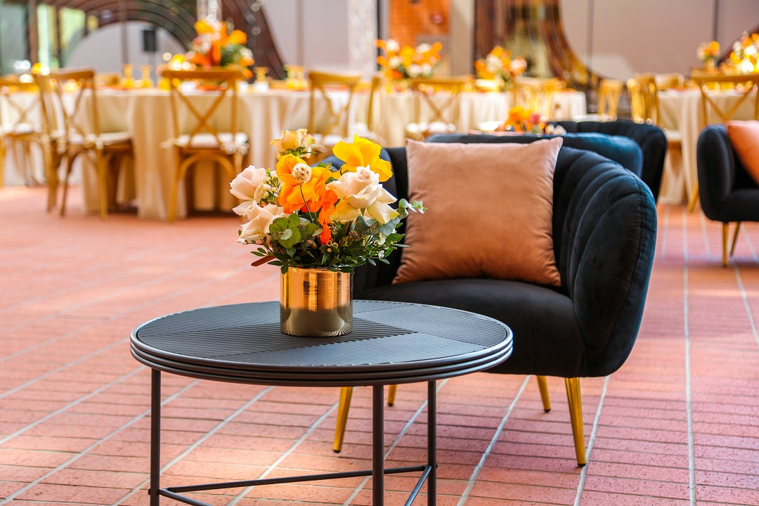 Black lined coffee table adorned with a vase of flowers, suitable for corporate events and home functions, available at Party Social.