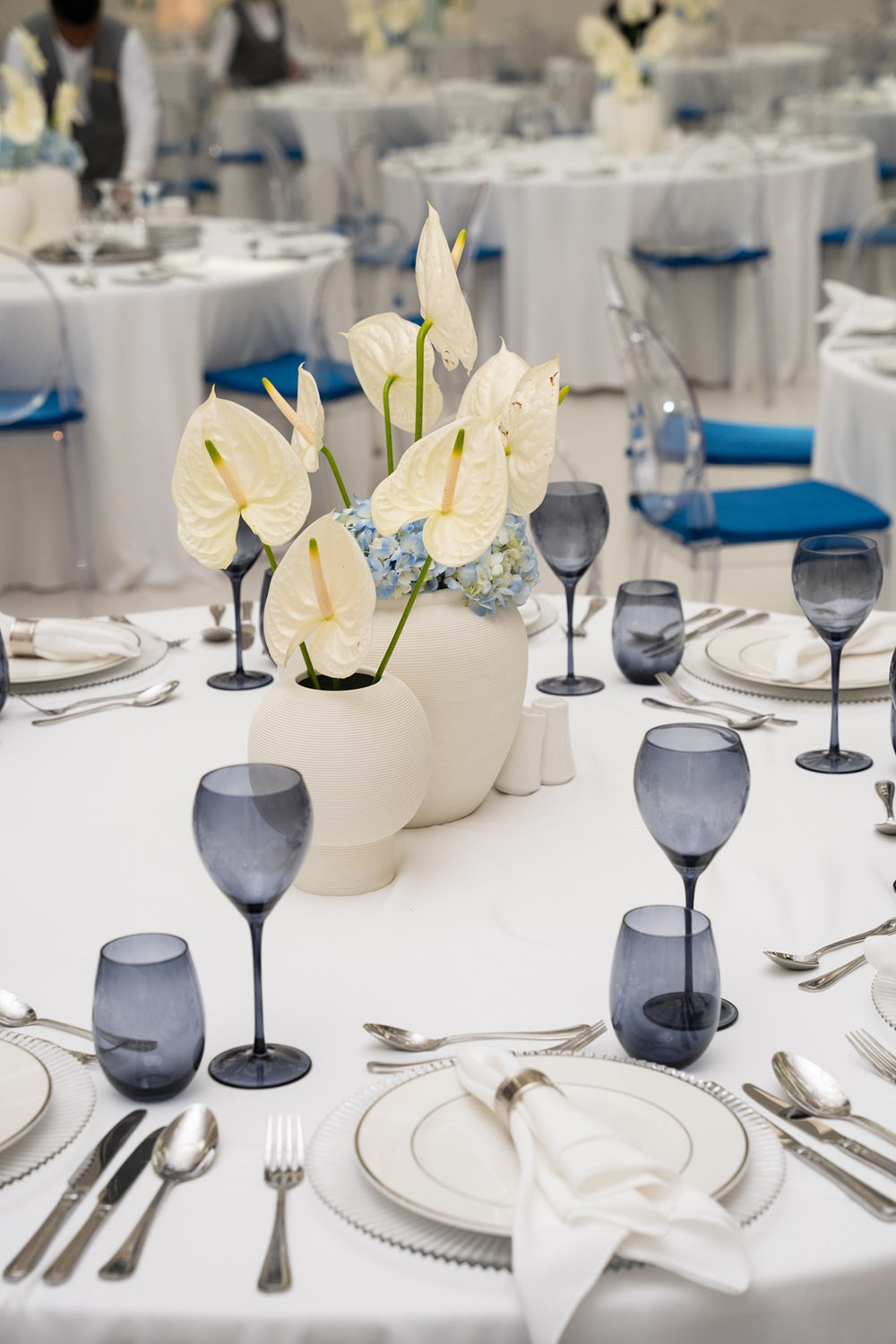 Off White Lined Pot on a dinner party table, elegantly set with glasses and tableware, showcasing its versatile use as a stylish centerpiece.