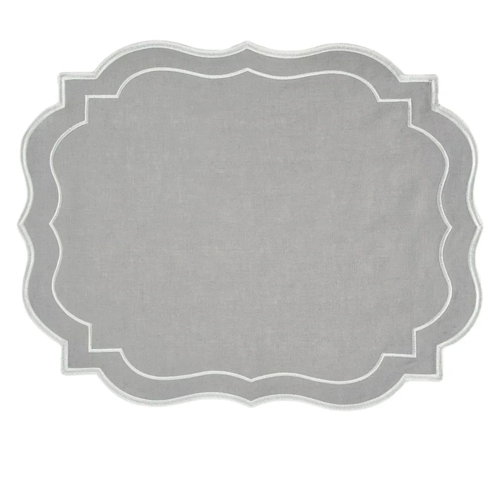 Light Grey Scalloped Linen Placemat with scalloped edge and white embroidery, showcasing elegant design for versatile table settings. Part of a set of four.