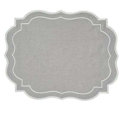 Light Grey Scalloped Linen Placemat with scalloped edge and white embroidery, showcasing elegant design for versatile table settings. Part of a set of four.