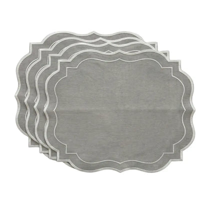 Set of gray placemats with scalloped edge on a white background
