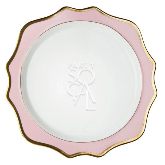 Pink Lotus Collection charger plate with a scalloped pink rim and gold edge, embossed with PARTY SOCIAL at the center, perfect for elegant dining settings.