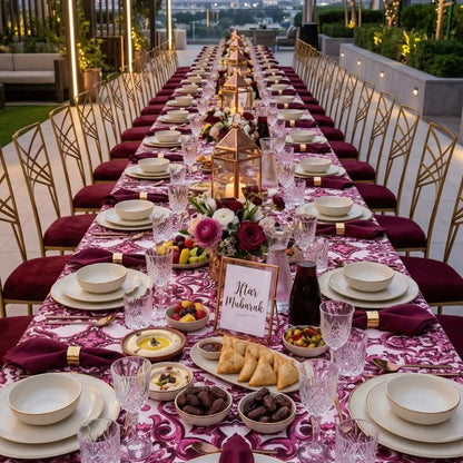 Majolica Rectangular Tablecloth elegantly drapes a long iftar table, adorned with gold-accented settings, floral decor, and Iftar Mubarak sign, perfect for festive gatherings.