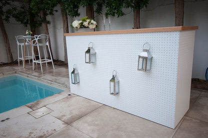 MODERN BAR UNIT displayed against a white wall with lanterns, ideal for garden or home settings, part of Party Social&