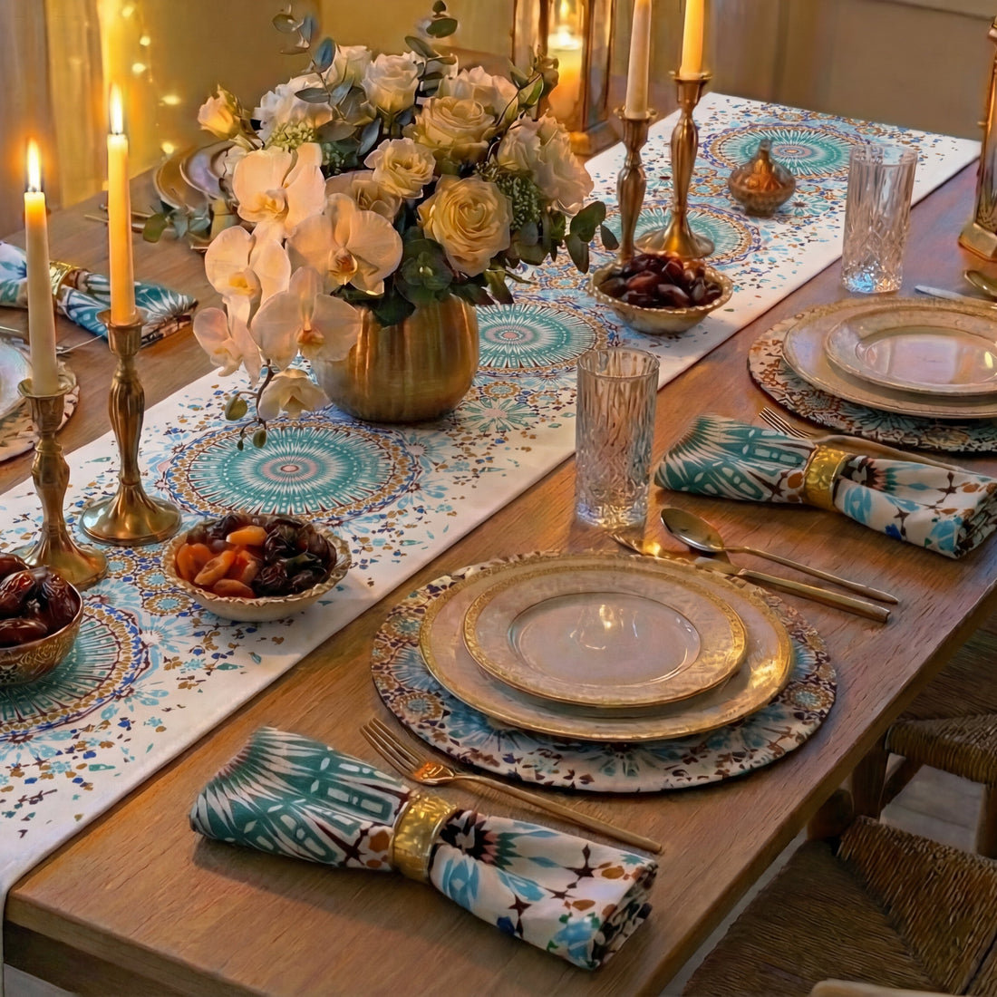 Dining table with Arabesque Polyester Linen Runner, teal and gold mandala pattern, gold accents, floral centerpiece, and elegant place settings, creating a luxurious, Middle Eastern-inspired tablescape.