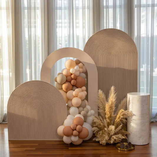 Mini Sand Molded Backdrop with sculptural elements, ideal for chic event styling, featuring arches, panels, and dried grasses for elegant photo opportunities.