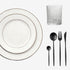 Minimalistic Tabletop Package featuring white plates with silver rims, a faceted tumbler, and matte-black flatware, perfect for elegant dining settings.