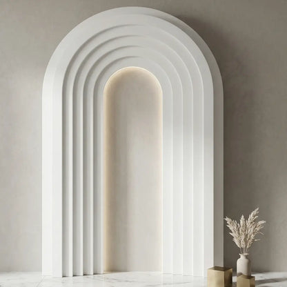 Molded Pure Backdrop with concentric panels and warm backlight, perfect for modern events. Accented with a ceramic vase and metallic cubes.