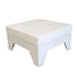 WHITE OTTOMAN SEATER: A square ottoman with legs, designed to complement lounge seating, ideal for event rentals or home decor. Measures 80cm x 80cm x 42cm.