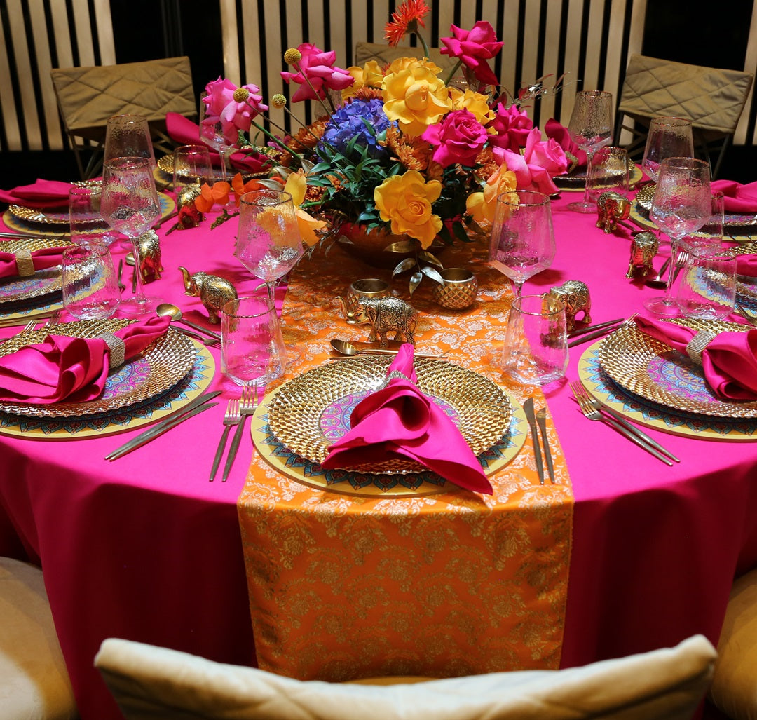 Brocade Table Runner elegantly displayed on a dinner party setting with tableware and floral centerpiece, showcasing luxurious event styling options from Party Social.