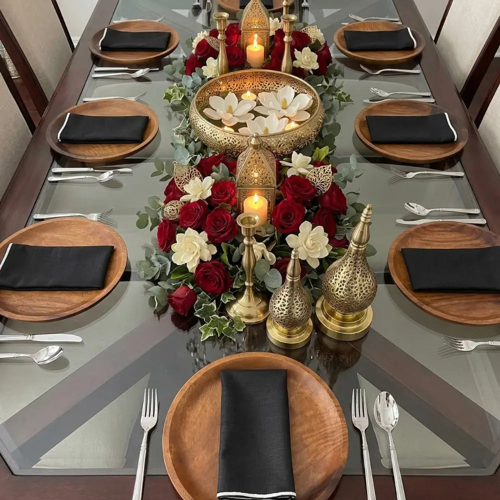 Dining table set for eight with NAPKIN BLACK W/ LINE, featuring lush florals and brass accents, showcasing Party Social&