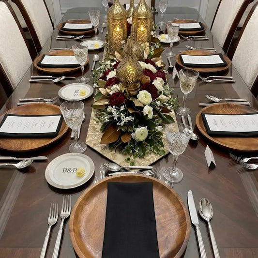 NAPKIN COTTON LINEN elegantly folded on a formal dining table, showcasing Party Social's premium event styling with polished flatware, crystal glasses, and floral centerpiece.