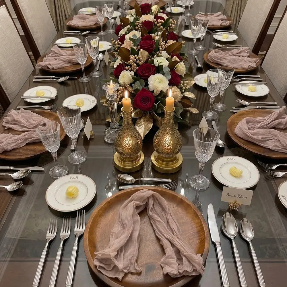 Elegant dining setup featuring NAPKIN GAUZE, loosely folded on wooden chargers, enhancing the formal table with crystal stemware and gold-accented decor for a sophisticated occasion.