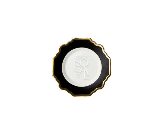 Black Lotus Collection decorative plate with a scalloped black rim, gold edge, and embossed PARTY SOCIAL white center, ideal for stylish dining settings.