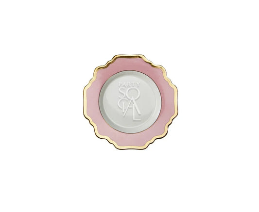 Pink Lotus Collection decorative plate with scalloped edge, pink rim, gold border, and PARTY SOCIAL centered, ideal for elegant dining and upscale events.