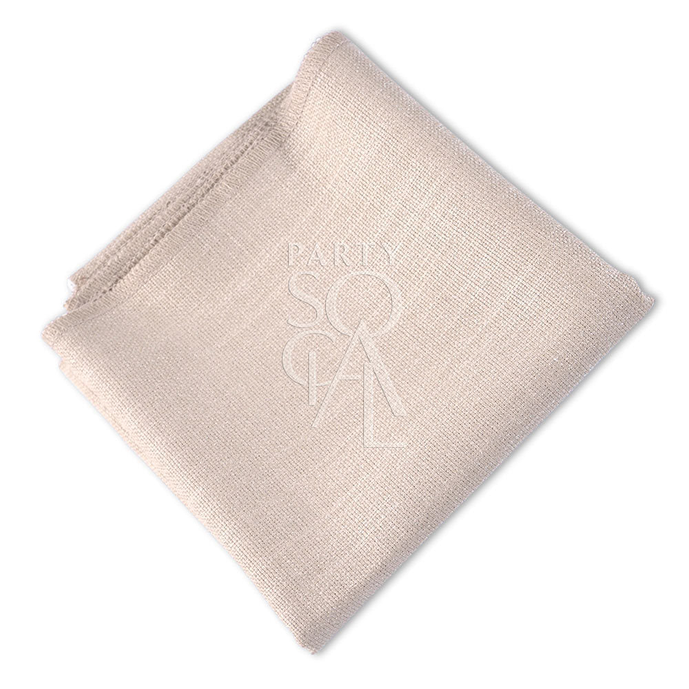 NAPKIN COTTON LINEN, folded with a close-up of a stitched logo, ideal for events like weddings or corporate gatherings, available from Party Social.