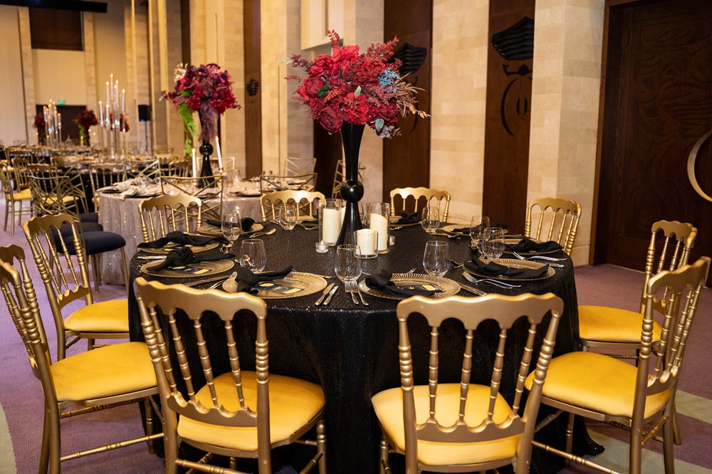 NAPOLEON GOLD CHAIR elegantly set at a formal dining table, ideal for weddings and corporate events, showcasing its versatility and sophisticated design.