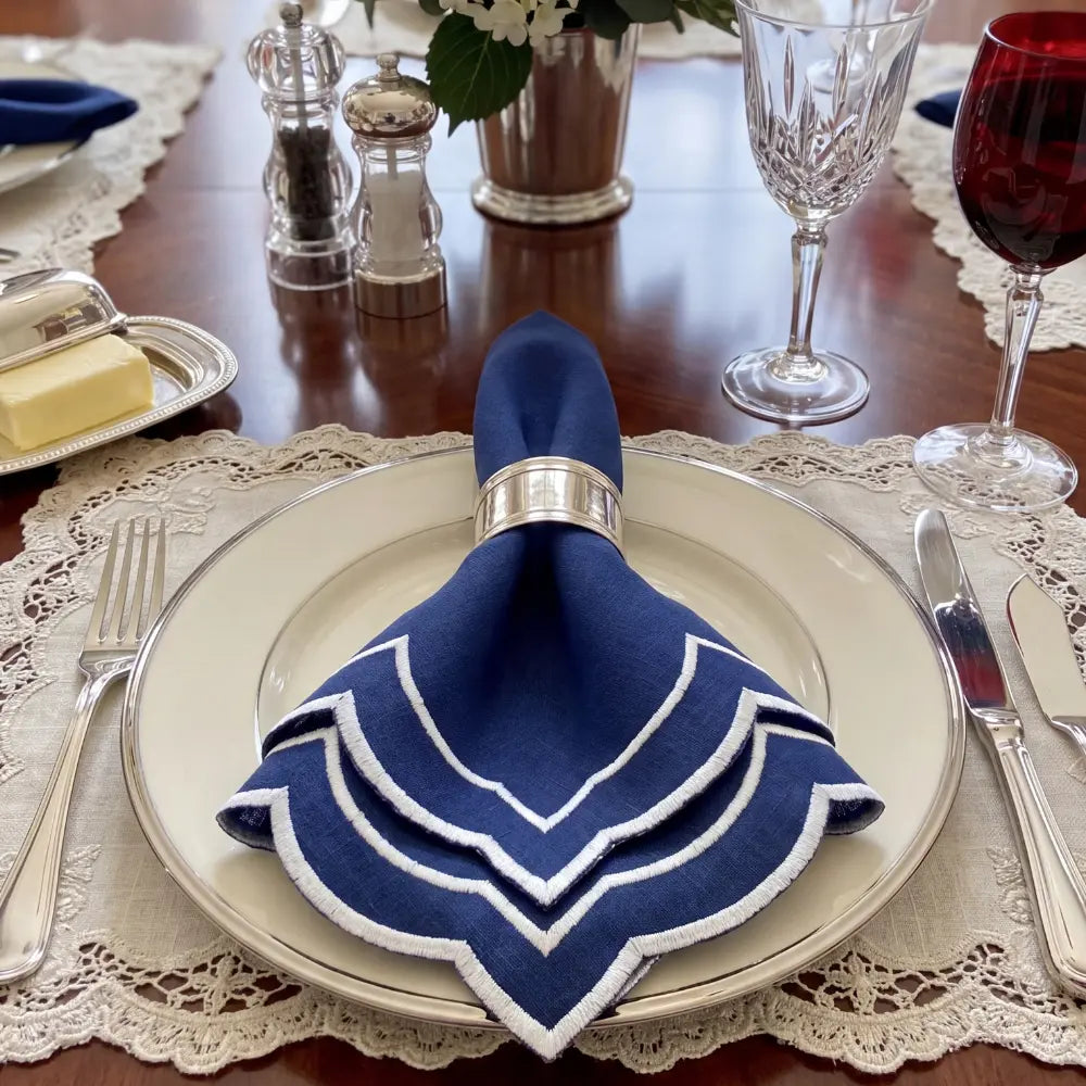 Navy Scalloped Linen Napkins - Set of 4, featuring dark-blue linen with scallop edges and white trim, ideal for elegant dining and special events.