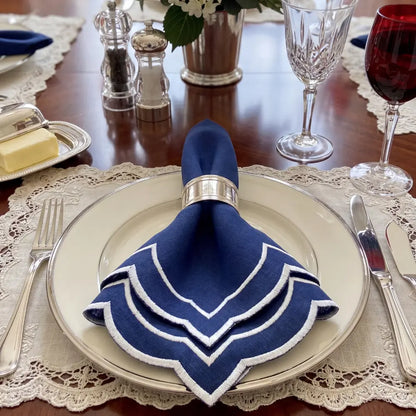 Navy Scalloped Linen Napkins - Set of 4, featuring dark-blue linen with scallop edges and white trim, ideal for elegant dining and special events.