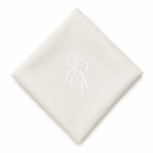 A square off white linen napkin displayed diagonally on a clean white background.