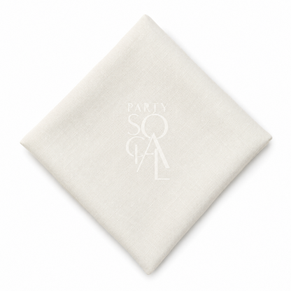 A square off white linen napkin displayed diagonally on a clean white background.

