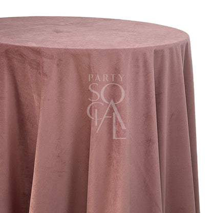 ROUND TABLECLOTH VELVET shown draped over a round table, highlighting its luxurious texture, ideal for enhancing special occasions and events.