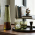 Decorative items on a wooden surface with a blurred background