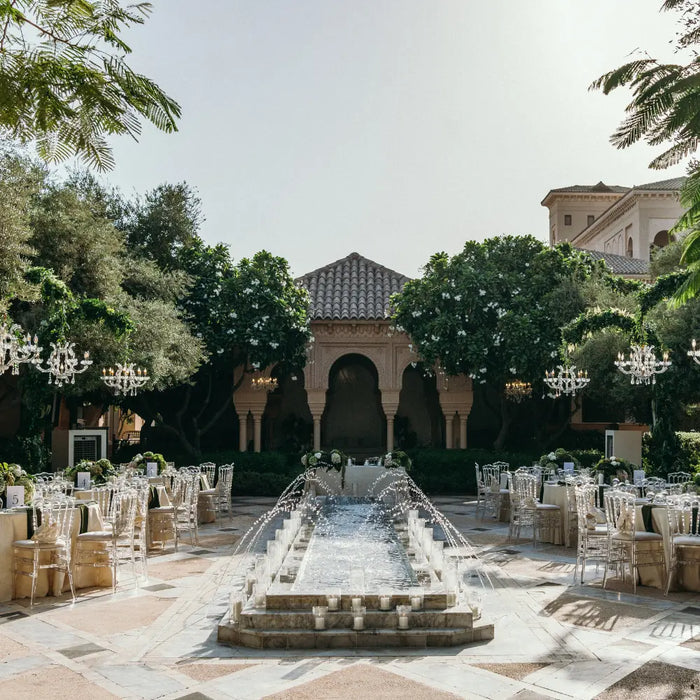 Outdoor wedding reception with hanging chandeliers