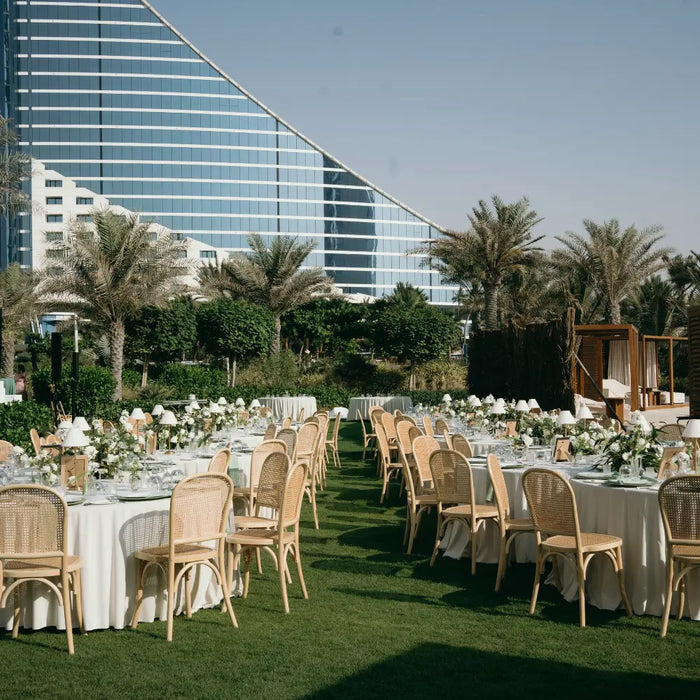 Outdoor wedding set-up with tables and chairs
