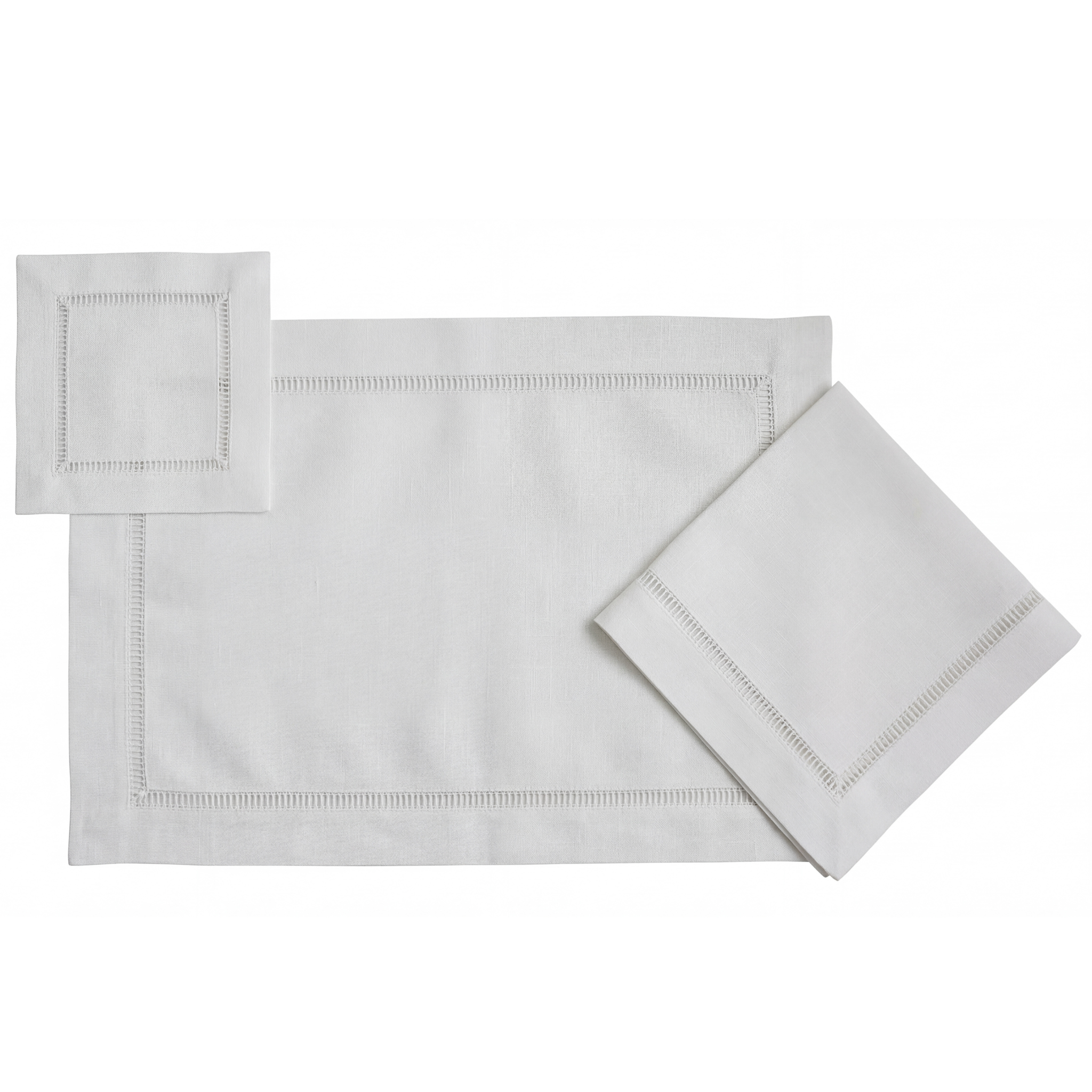 Classic Border Pure Linen Coaster in a set of four, displayed with matching white hem-stitched placemat and napkins, showcasing elegant tableware for special occasions.