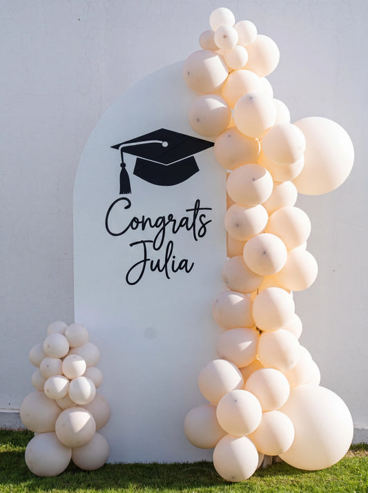 Sweet Soirée Balloon Arrangement featuring a personalized arch backdrop and customizable balloon garland, perfect for enhancing graduation celebrations or special events.