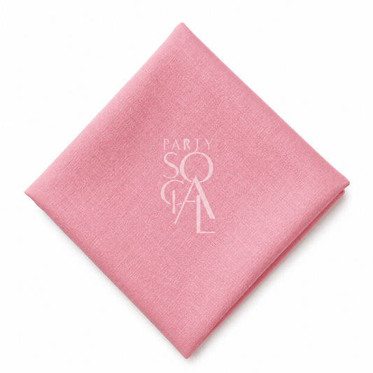 A square pink linen napkin displayed diagonally on a clean white background.