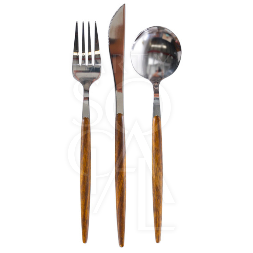CUTLERY WOODEN SILVER close-up showing a knife, fork, and tool with wooden handles, ideal for adding a dramatic touch to any dinner setting.