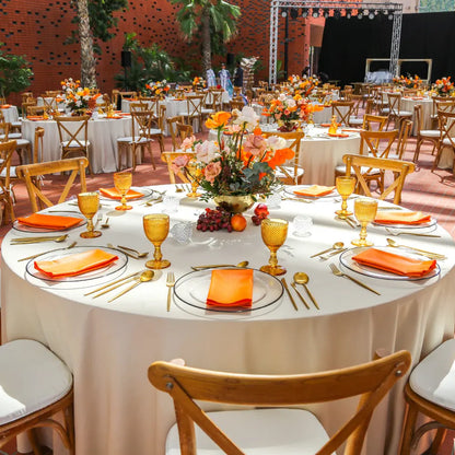 ROUND TABLECLOTH LINEN BLEND displayed on a set table with gold flatware and floral centerpiece, highlighting its elegant texture and suitability for formal events.