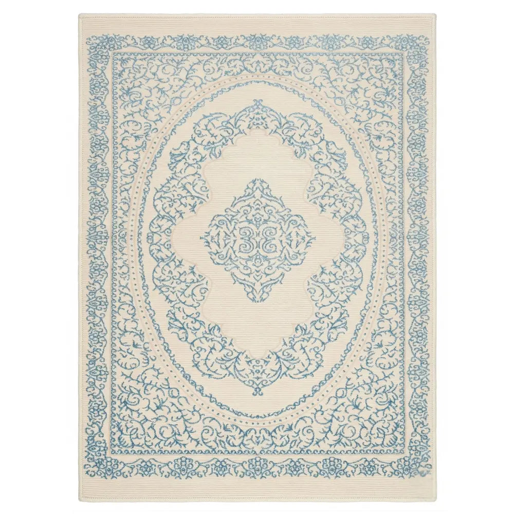 RUG TURQUOISE SWIRL: Cream area rug with ornate blue floral medallion pattern, ideal for adding elegance and warmth to any event space.