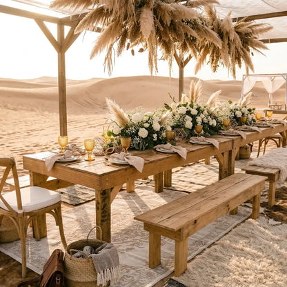 Rustic Wooden Bench set in a desert-themed dining setup under a pergola, surrounded by chairs and adorned with elegant table decor and floral arrangements.