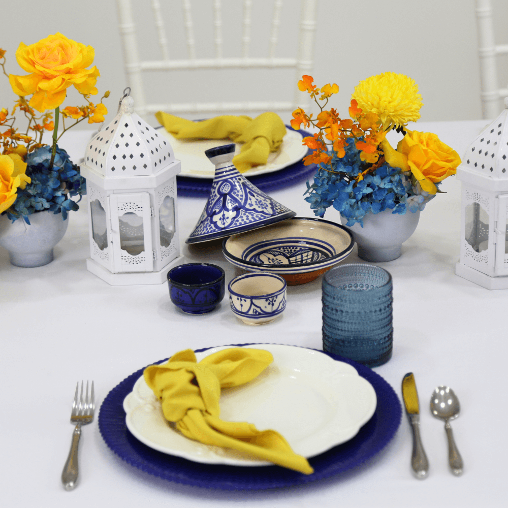 Moroccan Mirage-Dining Setup featuring tableware for 8 guests, including plates, gold cutlery, glasses, napkins, and Moroccan lanterns, perfect for elegant dining events.