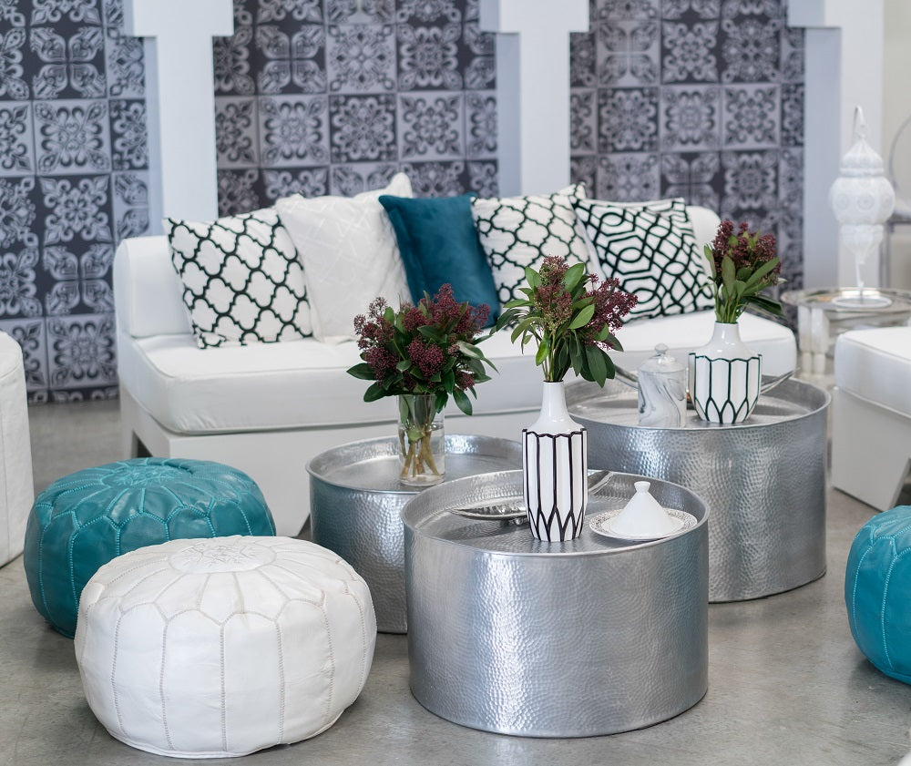 Aluminium coffee table with a hammered finish, shown in a stylish room setup. Ideal for events, available in three sizes, perfect for versatile space arrangements.