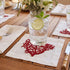 Red Coral Pure Linen Coaster - A white placemat with elegant red embroidery.