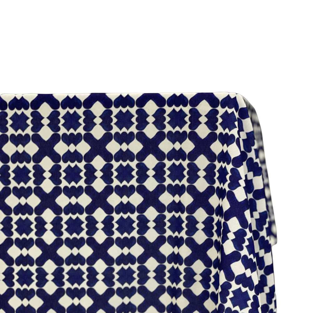 Marrakesh Linen Tablecloth with blue-and-white geometric pattern, enhancing event tables with a premium, reusable polyester fabric, ideal for party settings.