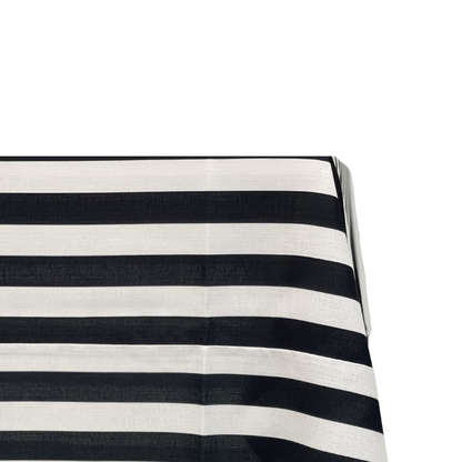 Black &amp; White Linen Tablecloth draped over a table, showcasing its premium polyester fabric and elegant striped design, ideal for enhancing any event setting.