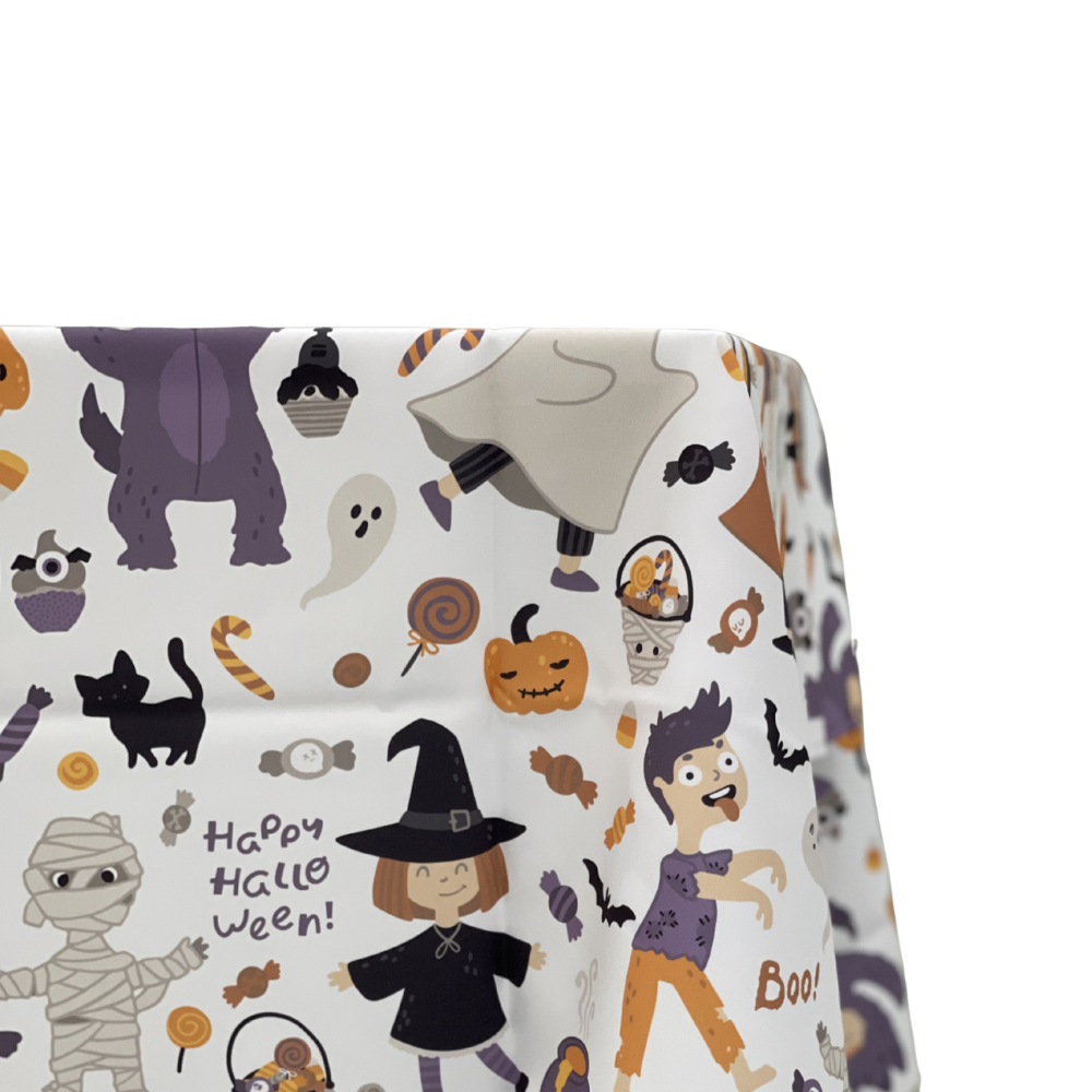 Trick or Treat Polyester Halloween Tablecloth featuring cartoon witches, mummies, ghosts, and festive phrases, perfect for enhancing your Halloween party table setting.