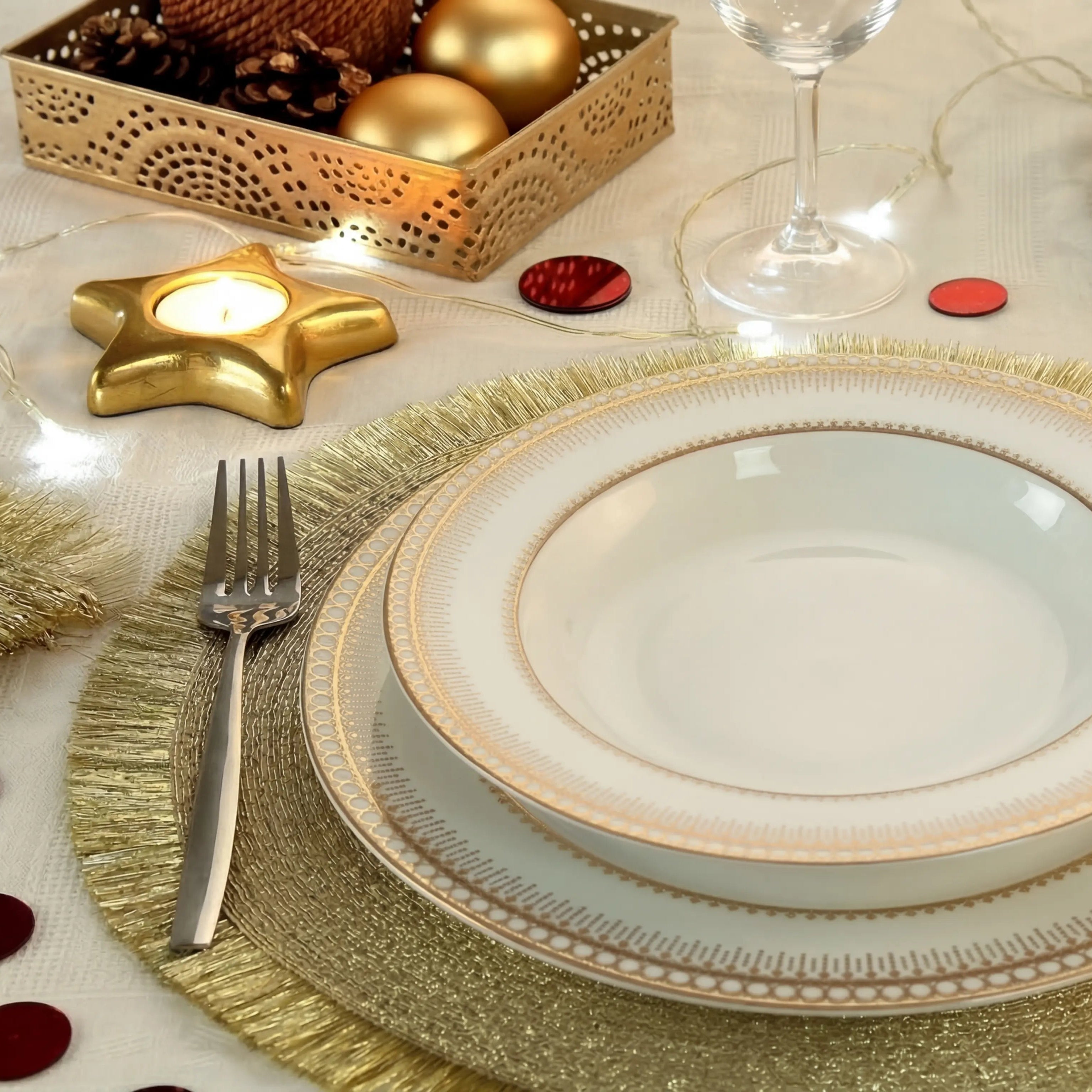 Golden Fringe Round Placemat - set of 4, elegantly enhances festive table settings with gold trim plates and warm string-lights, ideal for celebratory dining.
