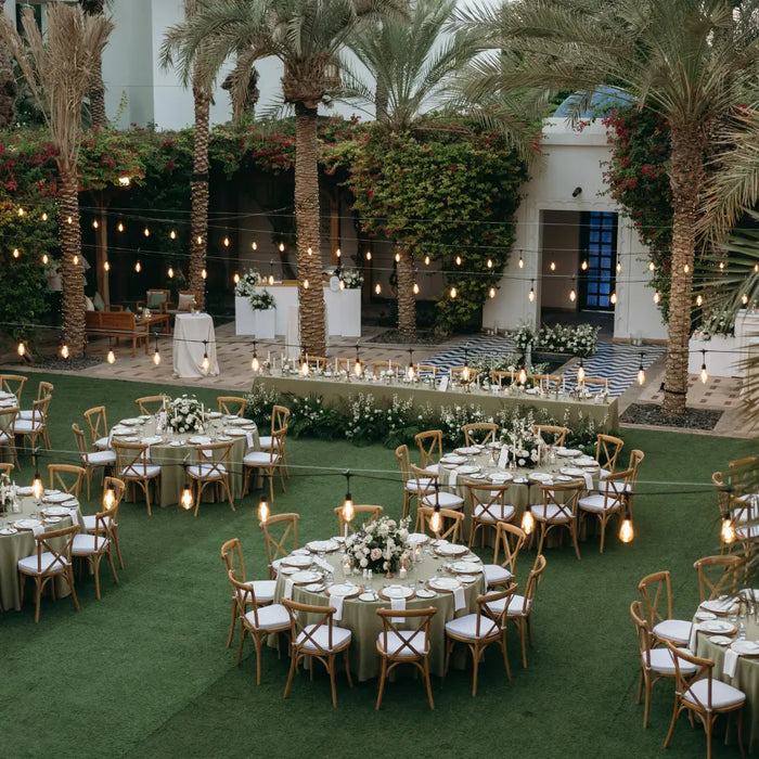 Round tables set for an outdoor wedding