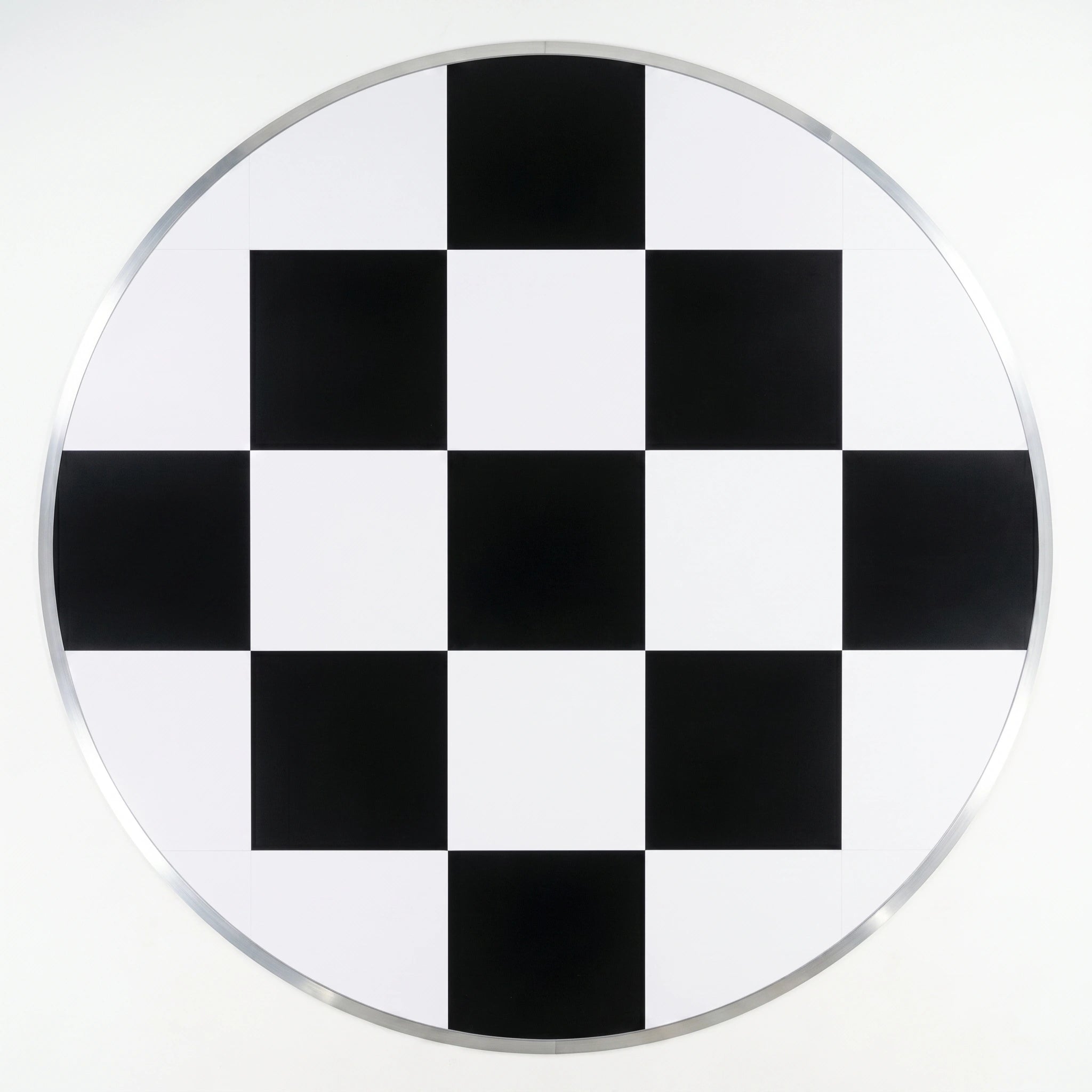 A circular dance floor a black and white checkerboard pattern with a polished silver metallic rim for weddings &amp; events 